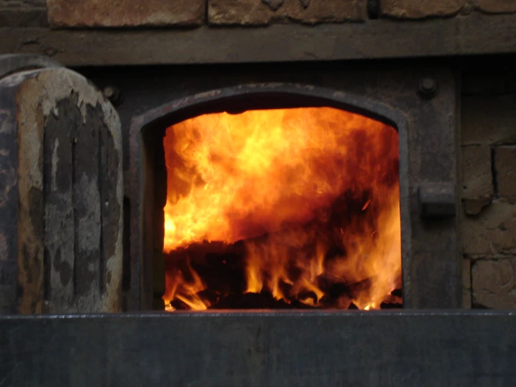 an old building has a fire burning in it