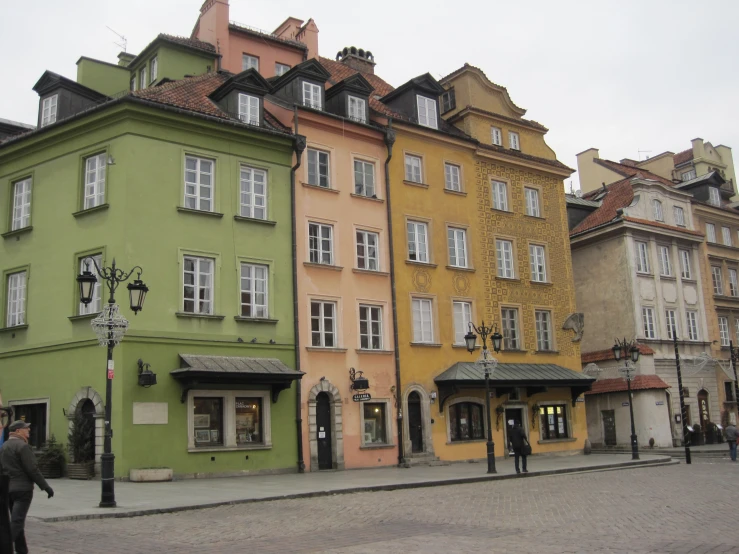 several different colored buildings in the middle of the city