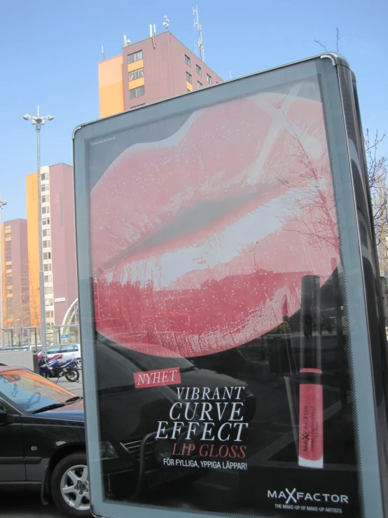 a billboard is shown in front of some cars