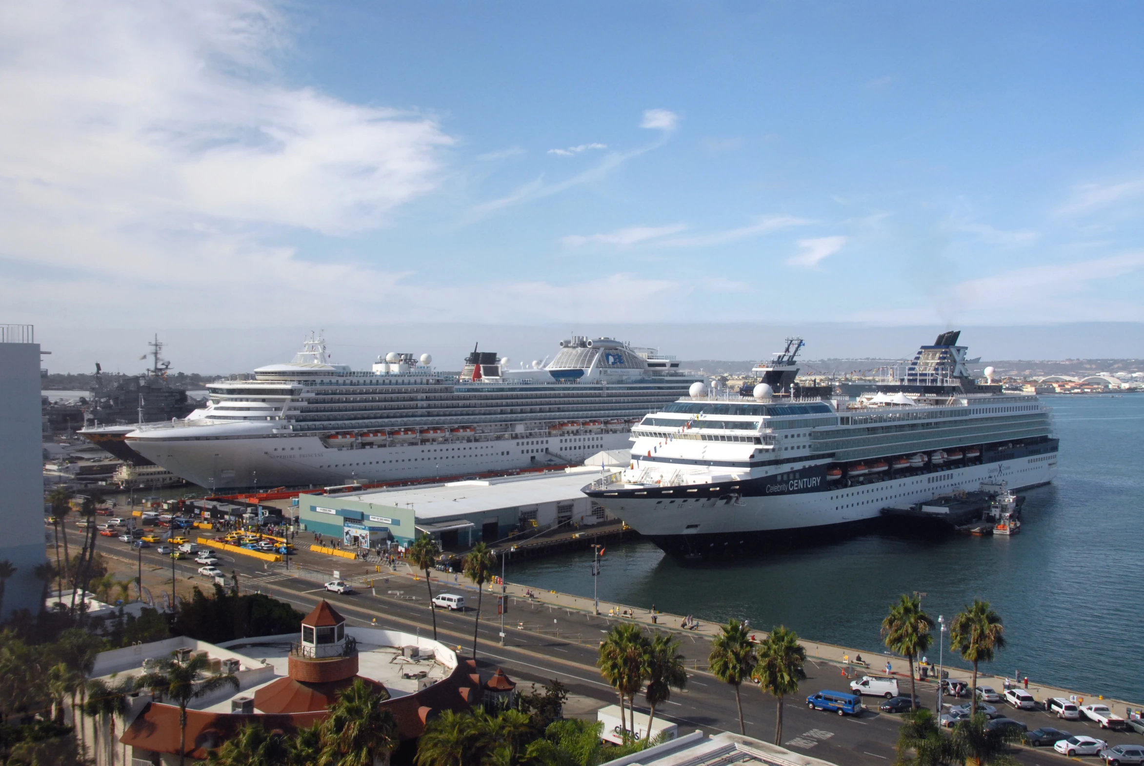 cruise ships docked in the port of a city