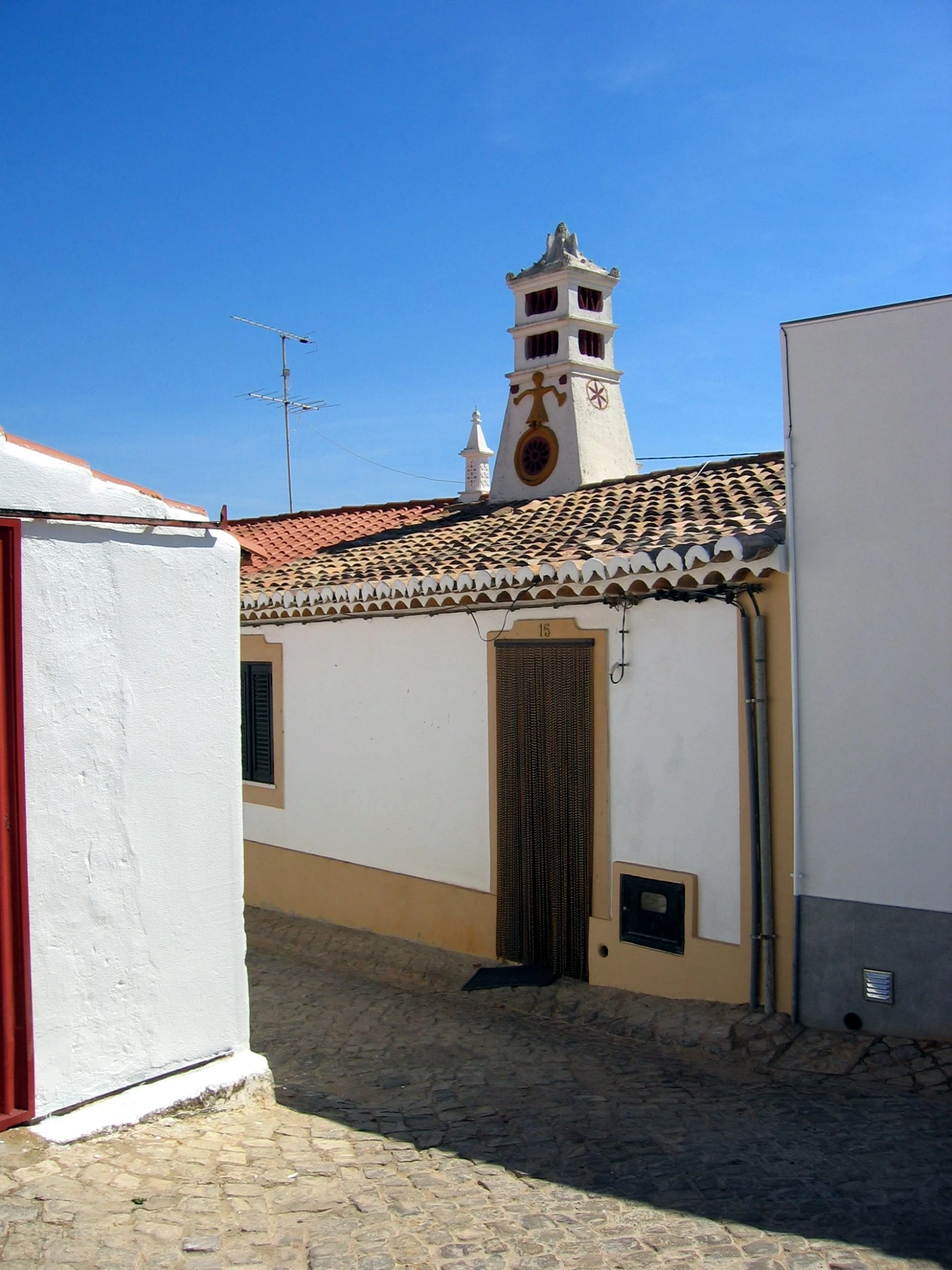 a tall clock tower on the top of a building