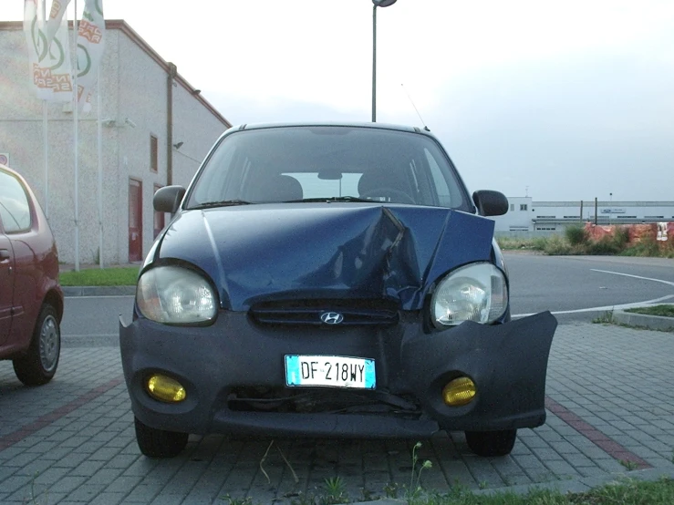 a small car has it's license plate removed
