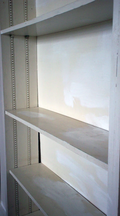 two shelves made out of some white shelving