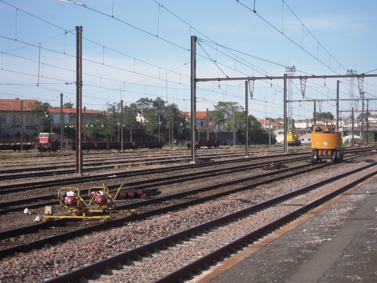 some train tracks with yellow carts on them