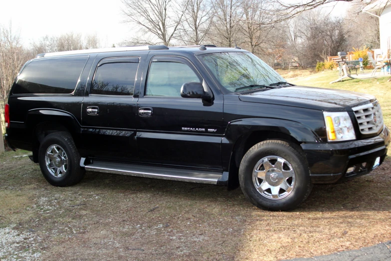 the front of a black truck with the door open