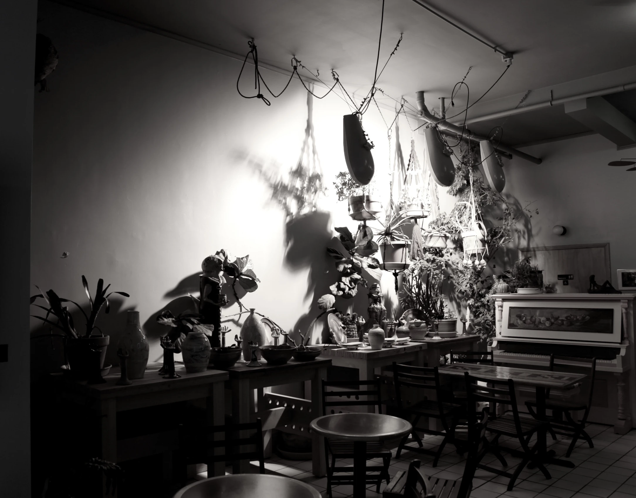 a dining area with chairs and a kitchen