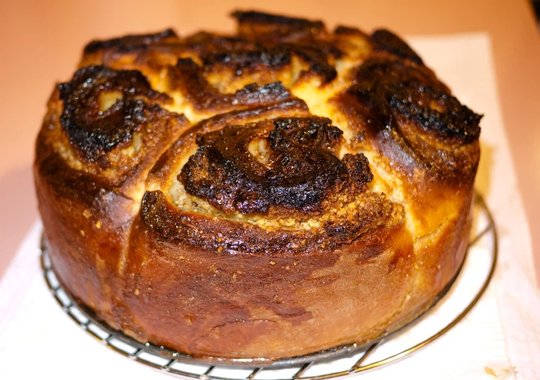 a delicious looking cinnamon bundt cake sitting on top of a rack