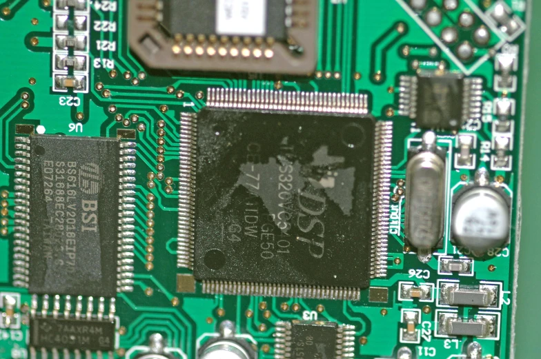a motherboard and cpu board showing the chip in the middle