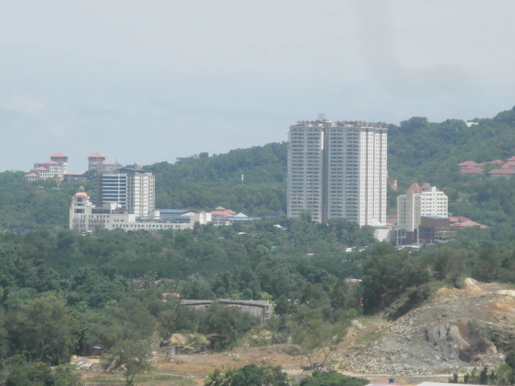 the city is surrounded by many buildings and a lot of trees