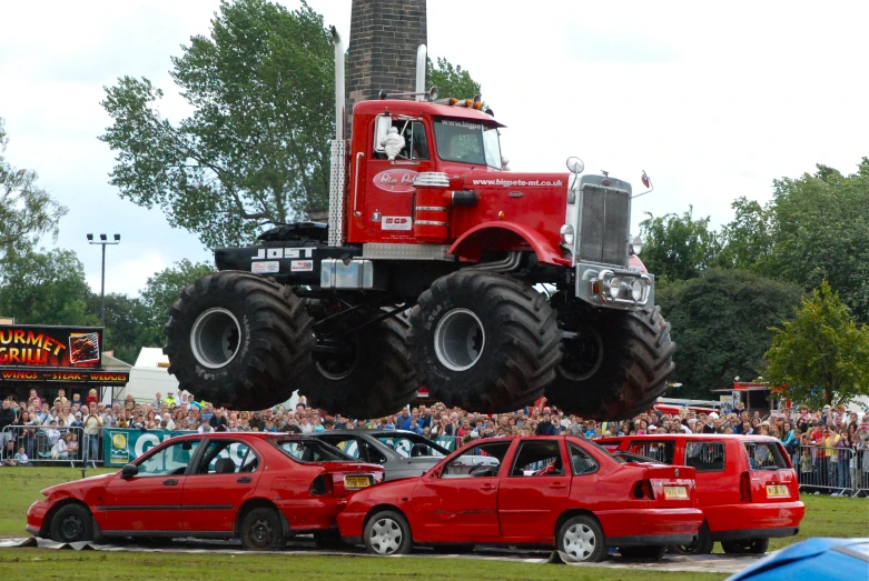 a red truck that is flying in the air