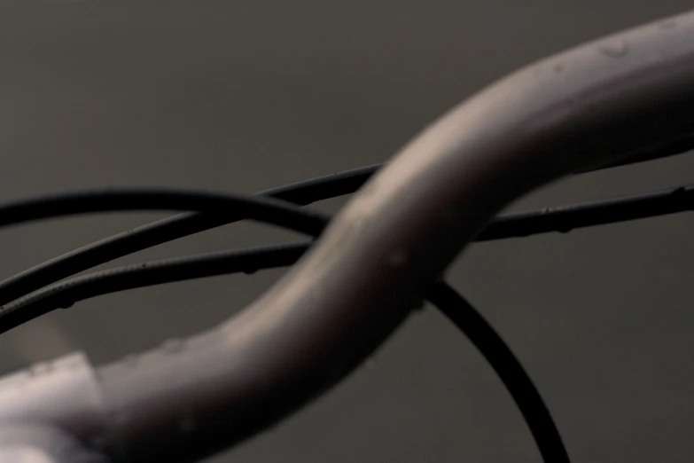 a closeup of a white wire and black background