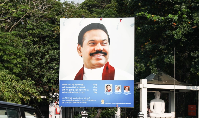 a billboard that has a political poster on it