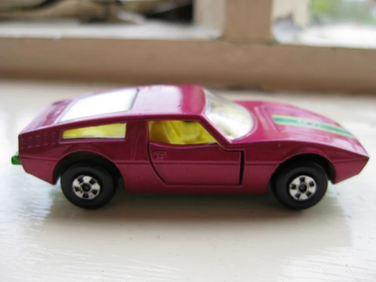 a toy sports car sitting on a counter top