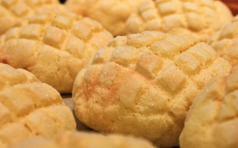 a pile of short round pastries that are on top of a table