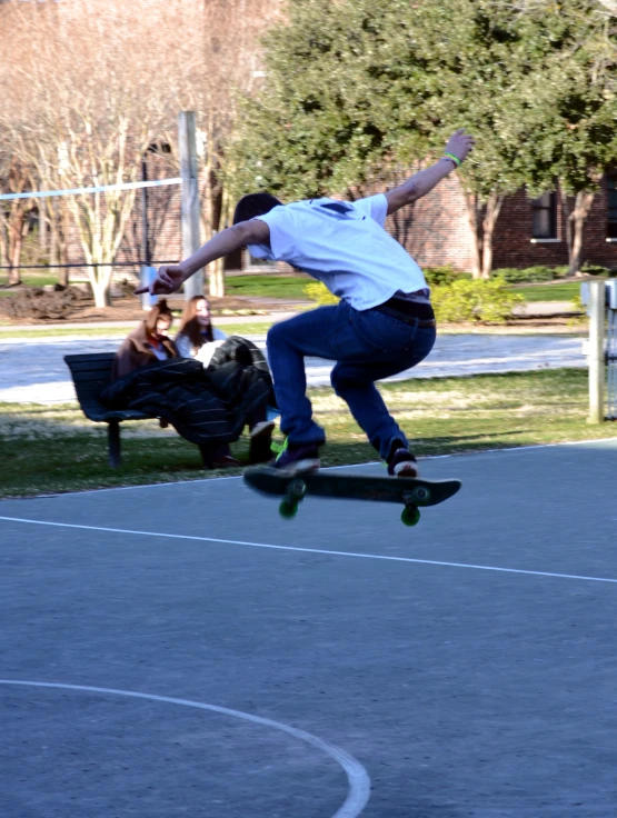 the person is doing a trick on his skateboard