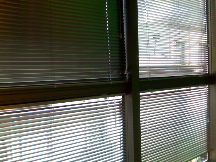 a window with some blinds closed on the outside