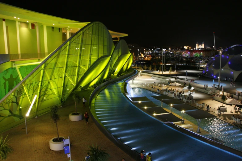 an elevated walkway leads up to a modern building