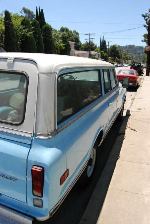 several cars parked on the side of the street