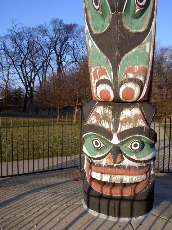 some kind of totem sitting on top of a street