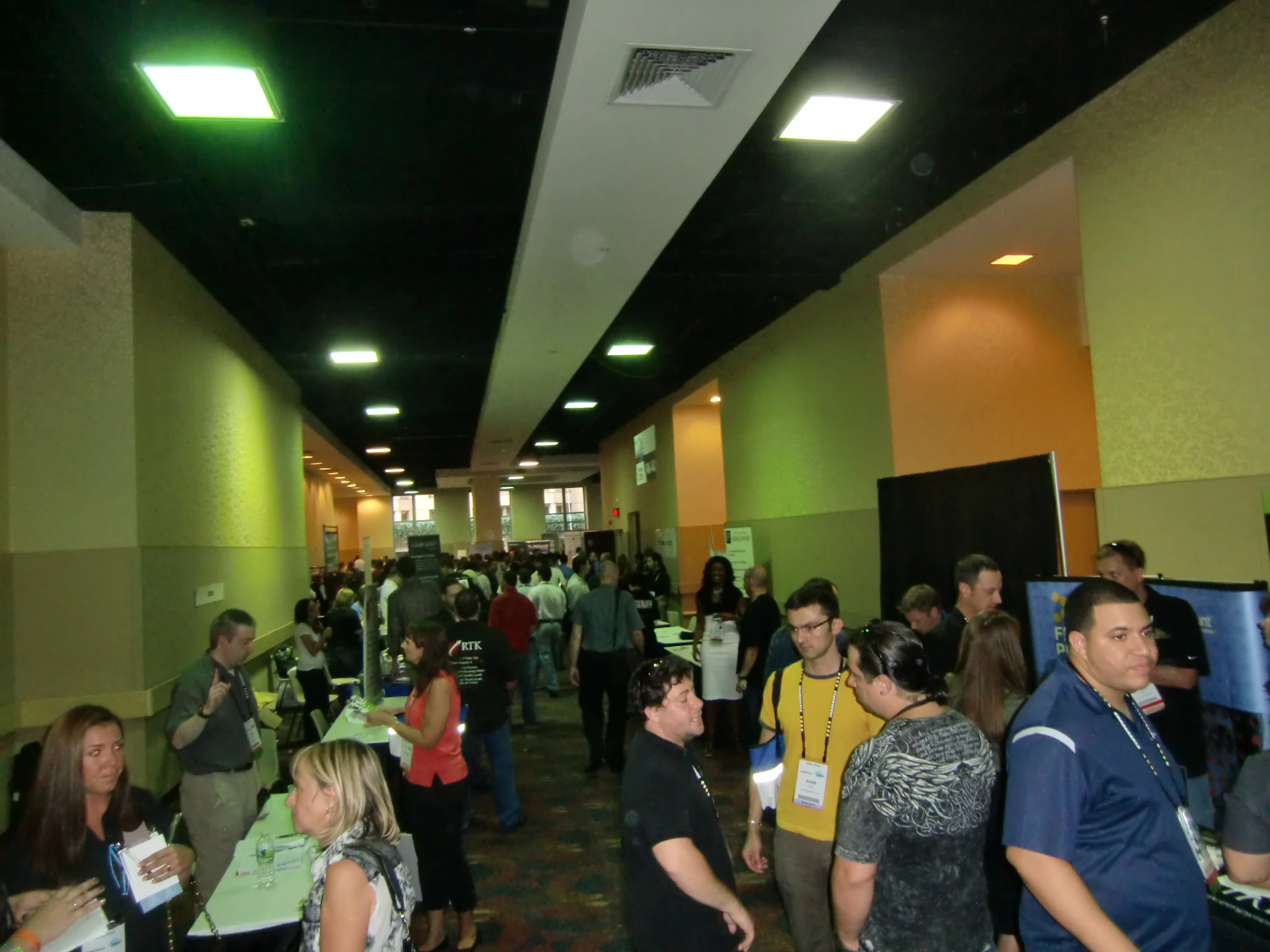 a long hallway with people standing inside of it