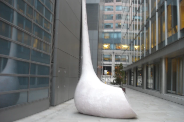 the large sculpture is made from a white plastic material