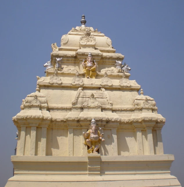 a very ornate looking building with figures on it