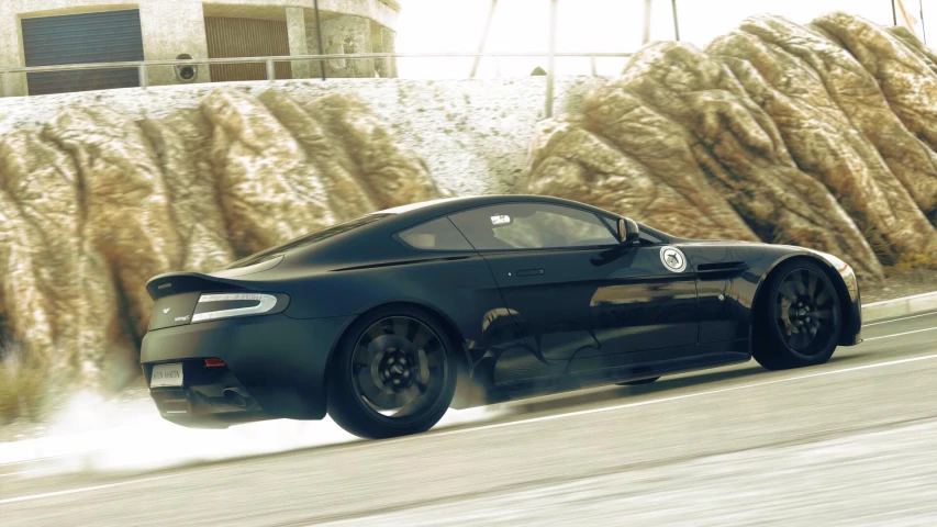 a car speeding down a street next to mountains