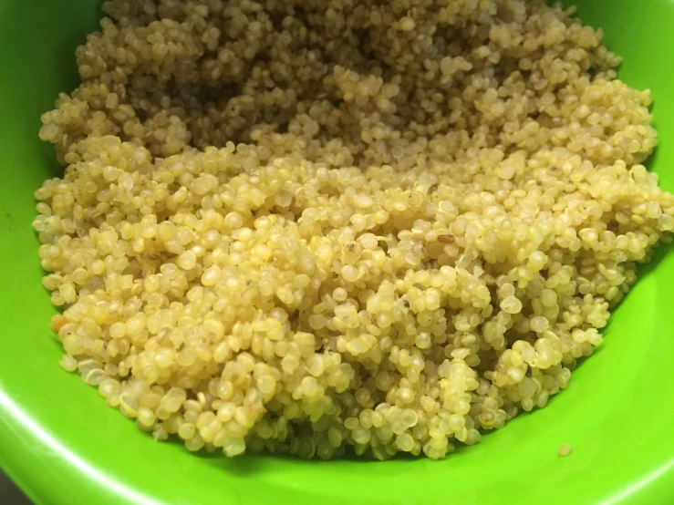 this is an image of sesame seeds in a green bowl