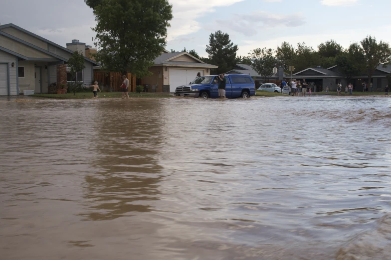 an image of flood waters in suburban area