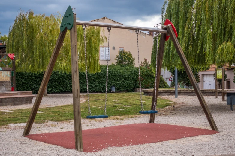 the children's swing in the park with swings