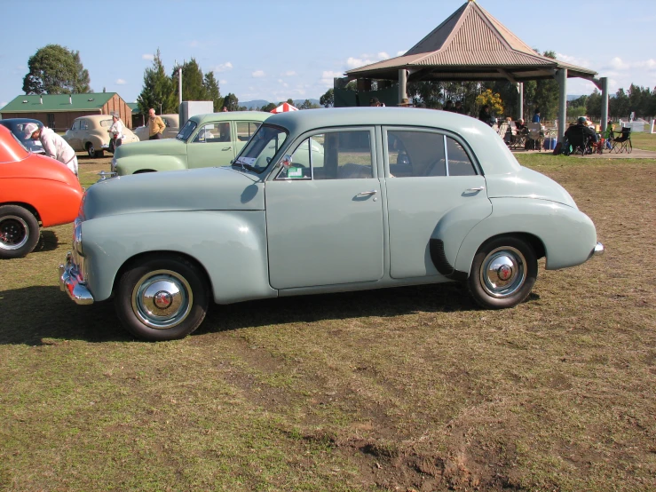 this is an old blue car on display