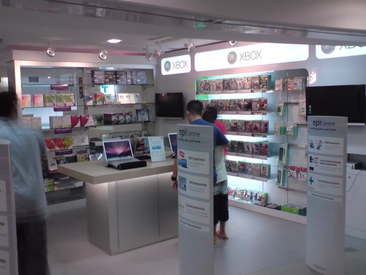 two people inside a store selling products