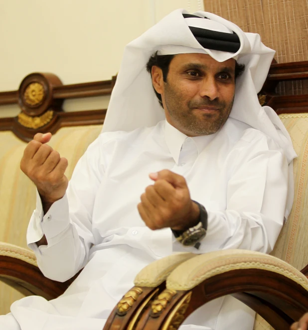 a person wearing a uniform sitting on a chair