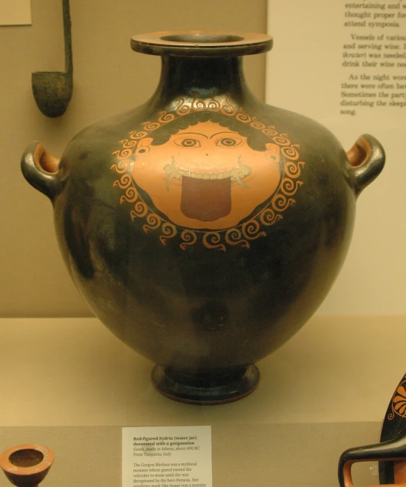 an antique greek vase in an exhibit