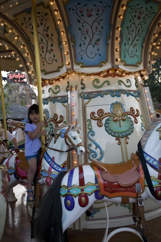 there is a colorful horse on the merry go round