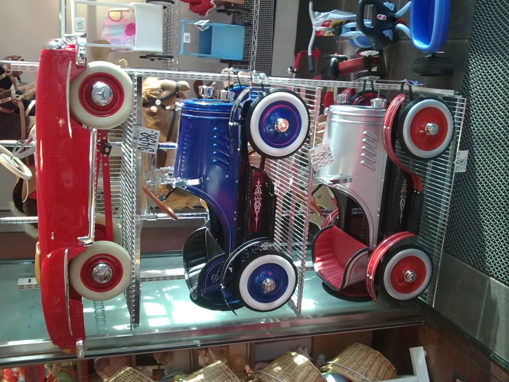 many different type of umbrellas lined up on a shelf