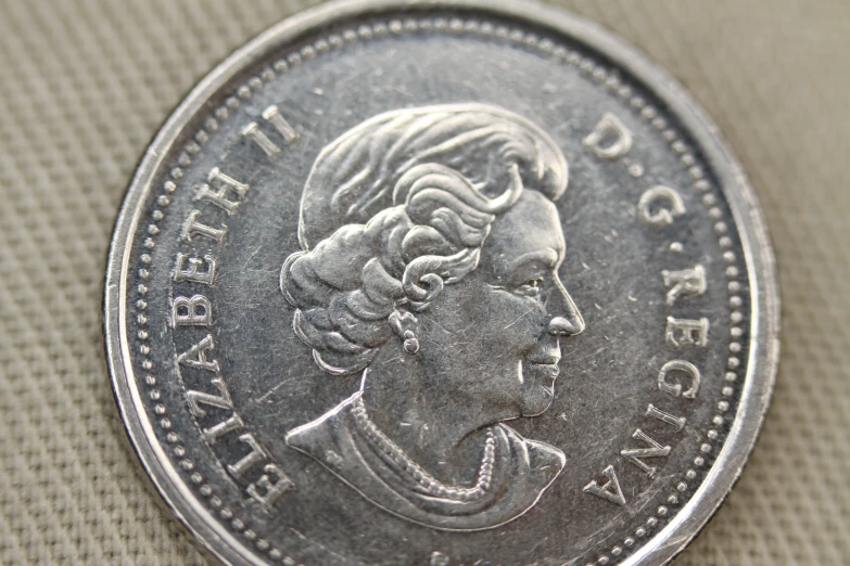 a close up view of the face of a coin