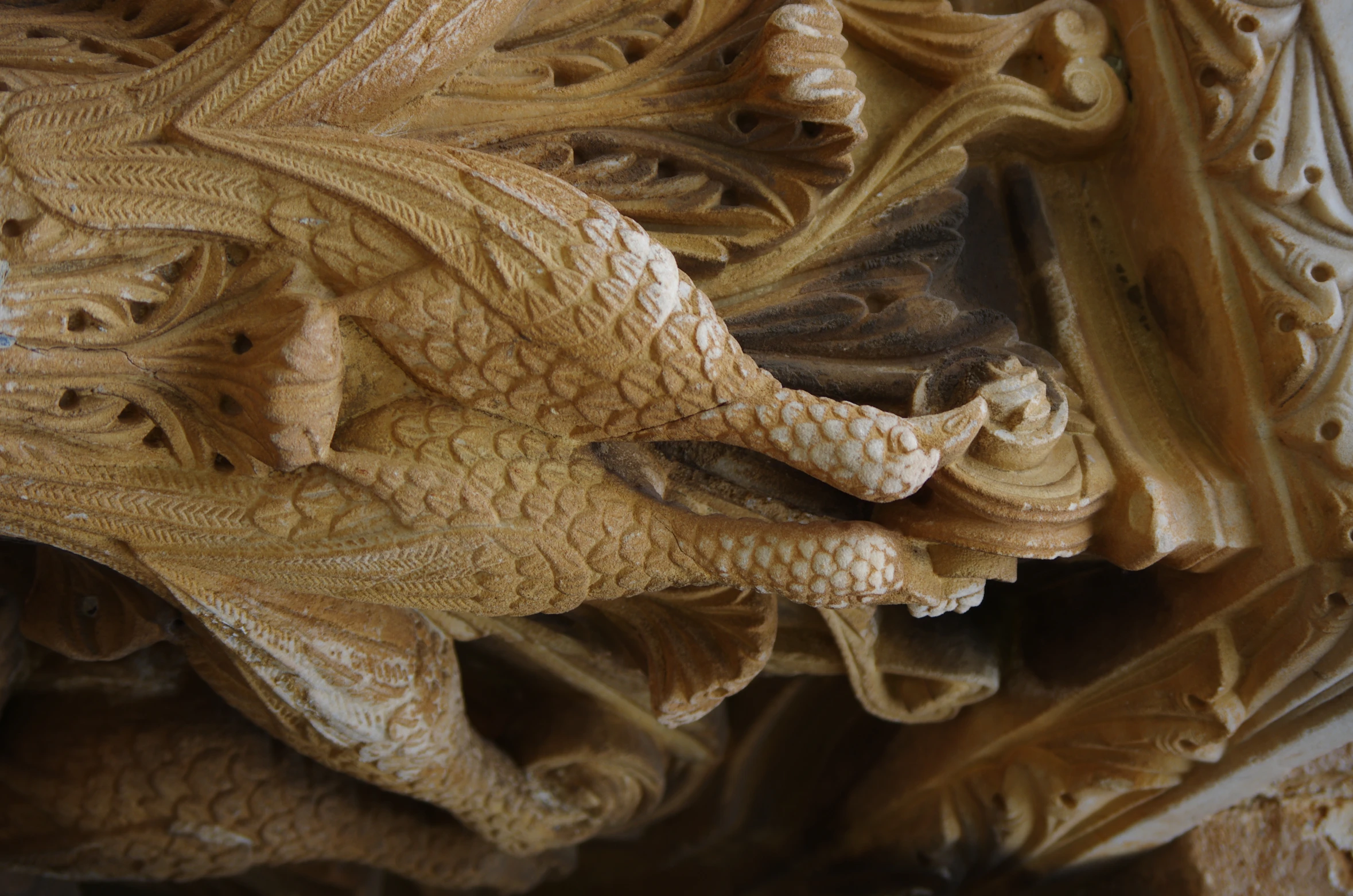 carved wooden sculpture depicting a peacock and another animal