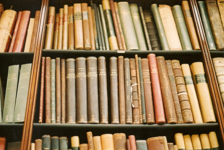 a bookcase filled with lots of books and many different types of books