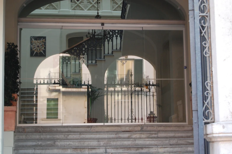 the reflection of an entry door to a building