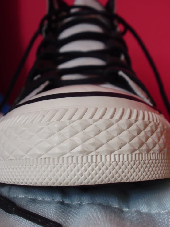 a close up s of a tennis shoe that appears to have been 