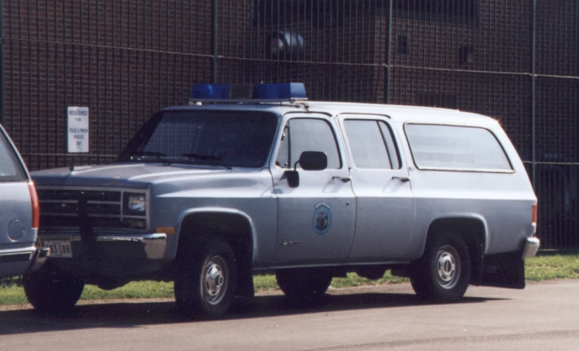 a police car parked in front of a building