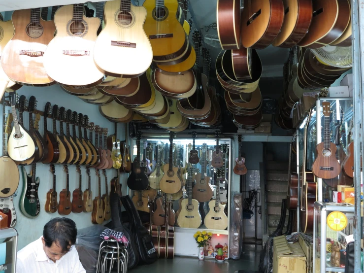 the guitar shop is full of guitars and their accessories