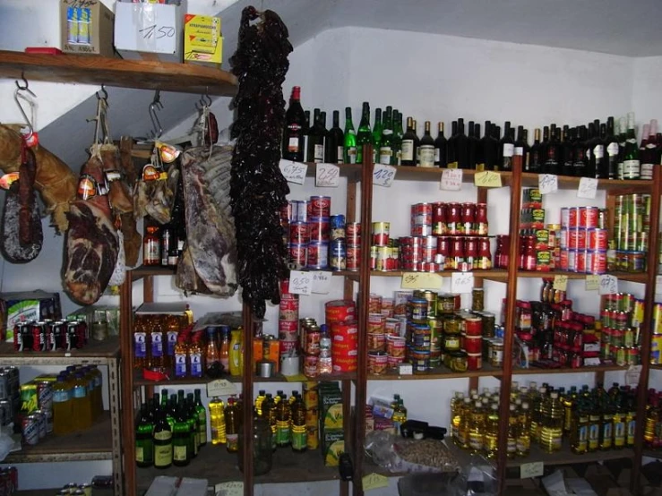 several items are stacked on shelving above the shelves