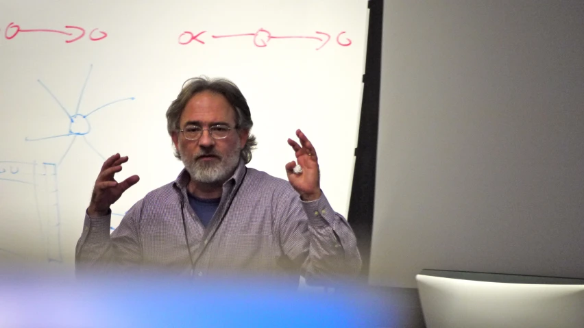 a man giving a lecture at an office