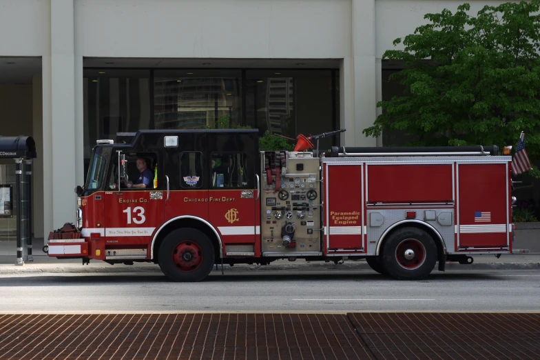 a fire truck is shown parked outside a building