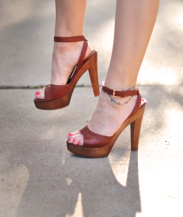 a woman's feet in a pair of platform shoes