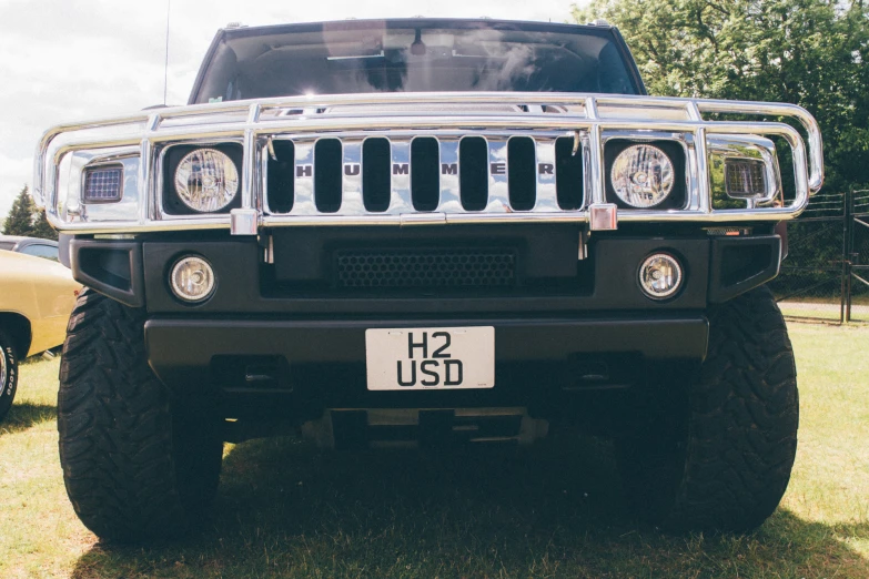 a black jeep is shown in front of the other trucks