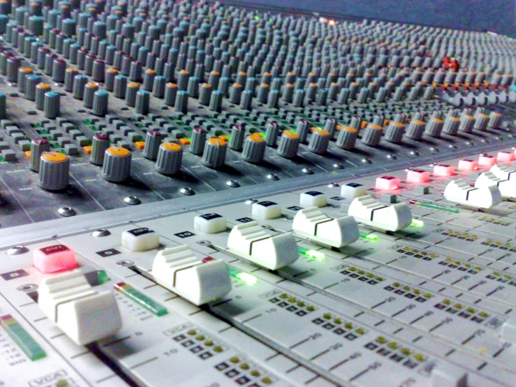 sound board with control ons and lights at night