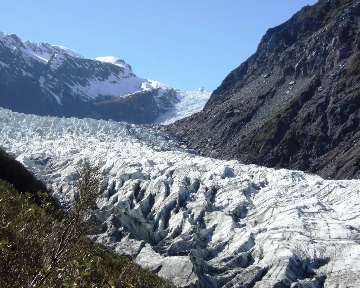 a glacier melts quickly into the water